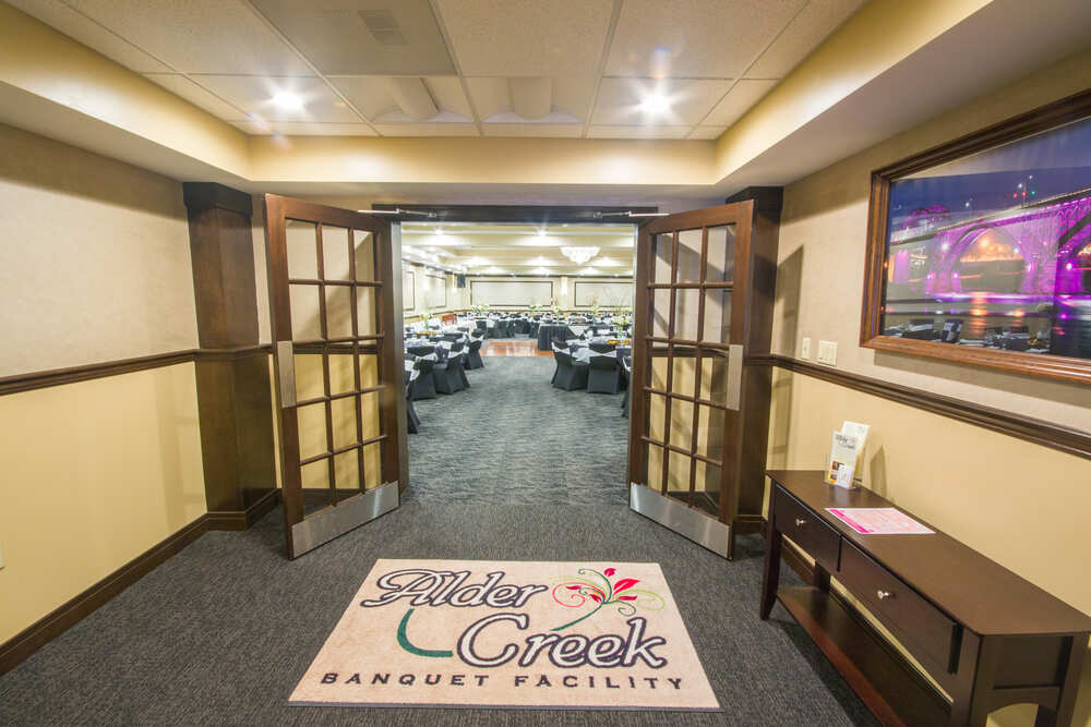 entry area at Alder Creek opening to an event space set with tables